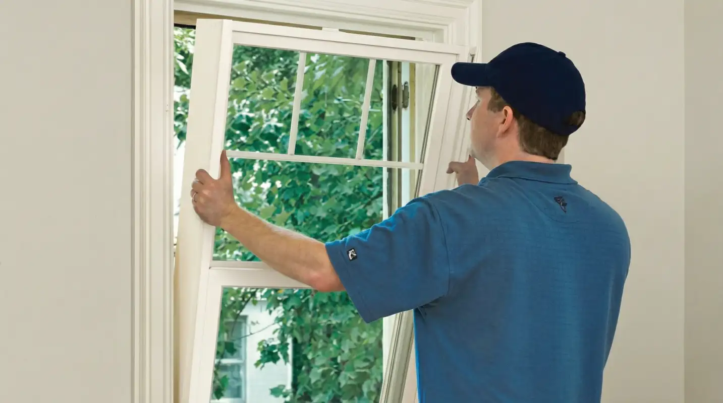 Professional contractors performing a residential window insulation and replacement service in Springfield, MO